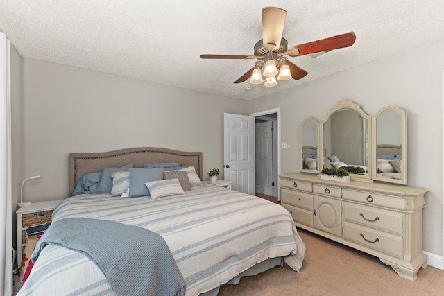 12403 Cassady Dr, Austin, TX 78727 - bedroom featuring light carpet, a ceiling fan, and a textured ceiling