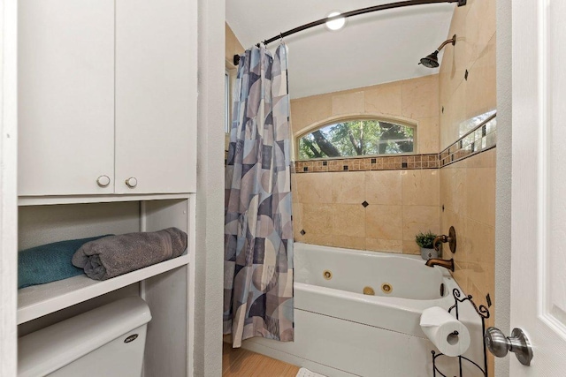 12403 Cassady Dr, Austin, TX 78727 - full bathroom with a combined bath / shower with jetted tub and wood finished floors