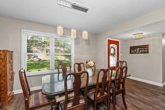 12403 Cassady Dr, Austin, TX 78727 - dining space with dark wood-type flooring and a textured ceiling