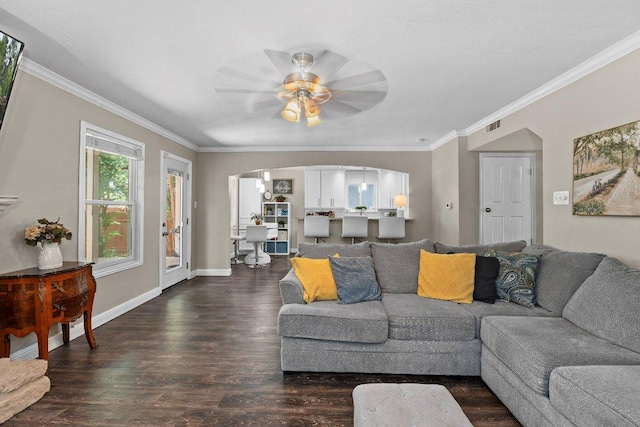 12403 Cassady Dr, Austin, TX 78727 - living room with arched walkways, a ceiling fan, wood finished floors, and crown molding