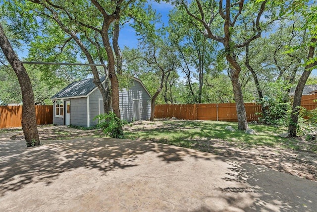12403 Cassady Dr, Austin, TX 78727 - fenced backyard featuring an outbuilding and a patio area