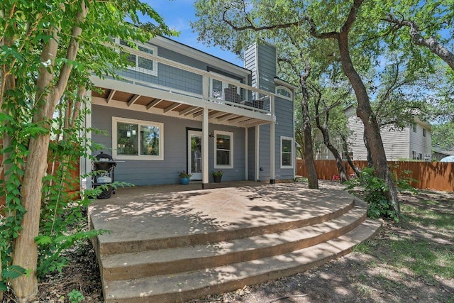 12403 Cassady Dr, Austin, TX 78727 - back of house featuring a balcony and a chimney