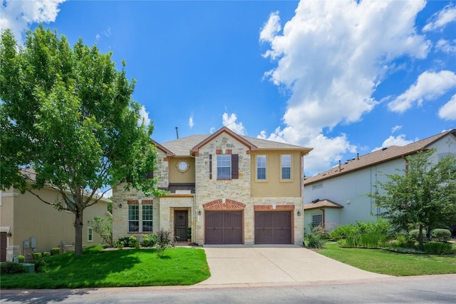 21 Green Terrace Cv, Lakeway, TX 78734 - traditional-style home with stone siding, driveway, an attached garage, a front lawn, and stucco siding