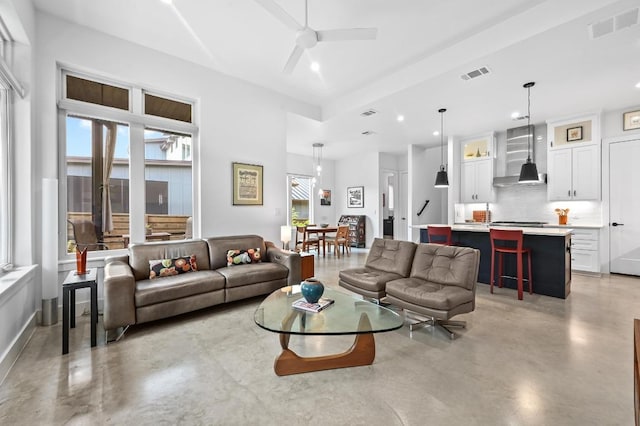 2107 Greenwood Ave Unit B, Austin, TX 78723 - living area with concrete floors, a ceiling fan, and recessed lighting