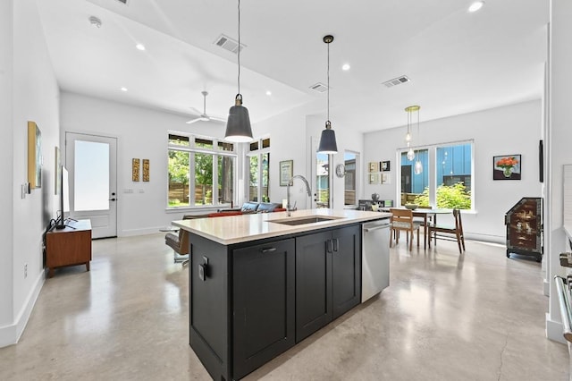 2107 Greenwood Ave Unit B, Austin, TX 78723 - kitchen featuring stainless steel dishwasher, dark cabinets, concrete flooring, light countertops, and recessed lighting