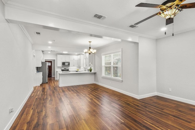 522 S Walnut Ave, Luling, TX 78648 - unfurnished living room with dark wood-style floors, a chandelier, crown molding, and ceiling fan