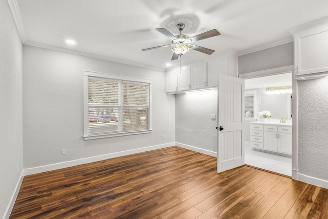 522 S Walnut Ave, Luling, TX 78648 - spare room with crown molding, wood finished floors, a ceiling fan, a textured wall, and recessed lighting