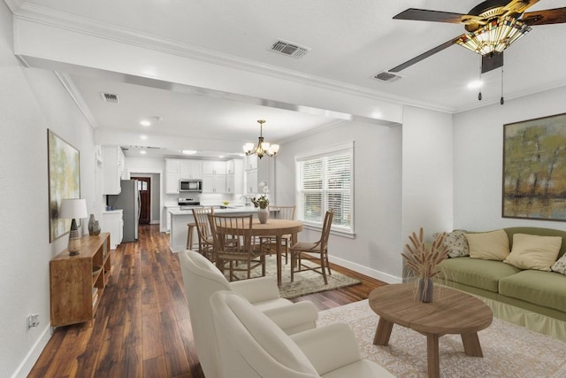 522 S Walnut Ave, Luling, TX 78648 - living room with a chandelier, dark wood-style floors, crown molding, a ceiling fan, and recessed lighting