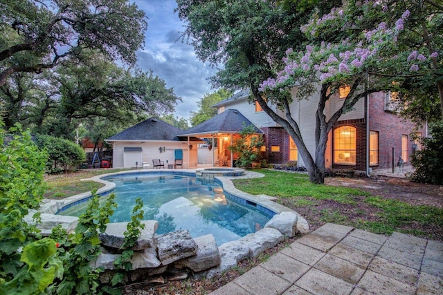 10601 Queensbury Cv, Austin, TX 78726 - view of swimming pool featuring a pool with connected hot tub and a patio