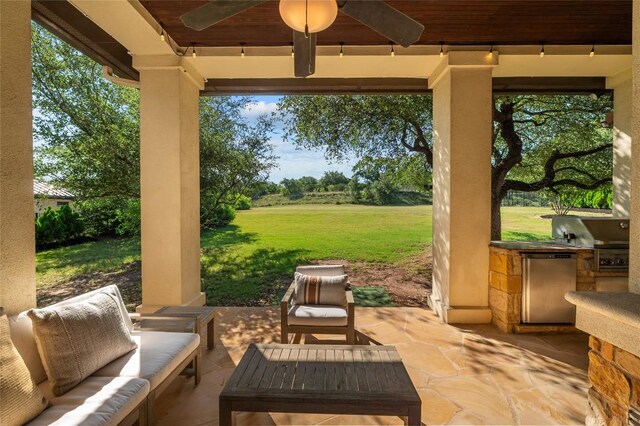 107 Bella Strada Cv, Lakeway, TX 78734 - view of patio / terrace featuring exterior kitchen, a ceiling fan, and an outdoor hangout area