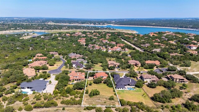 107 Bella Strada Cv, Lakeway, TX 78734 - aerial view of residential area with a large body of water and property boundaries highlighted