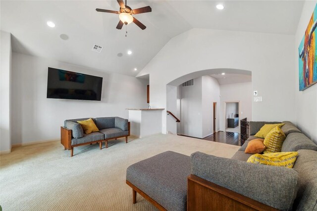 107 Bella Strada Cv, Lakeway, TX 78734 - living room with ceiling fan, arched walkways, vaulted ceiling, recessed lighting, and carpet flooring