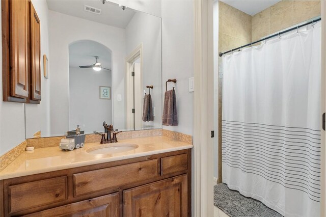 107 Bella Strada Cv, Lakeway, TX 78734 - bathroom featuring a ceiling fan, vanity, and curtained shower