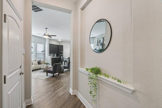 113 Berkeley Pl, Georgetown, TX 78628 - corridor with dark wood-style flooring and baseboards