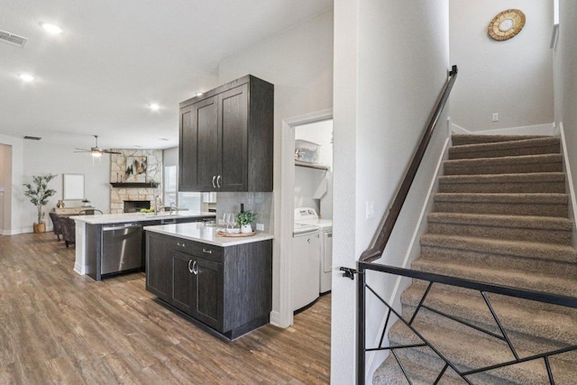 113 Berkeley Pl, Georgetown, TX 78628 - kitchen with washer and clothes dryer, dishwasher, ceiling fan, wood finished floors, and recessed lighting