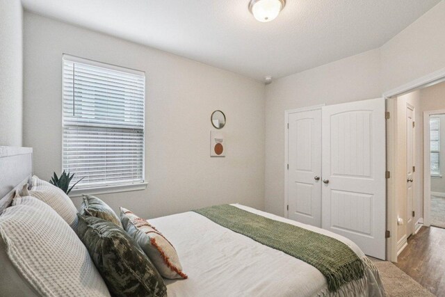 113 Berkeley Pl, Georgetown, TX 78628 - bedroom featuring wood finished floors and a closet
