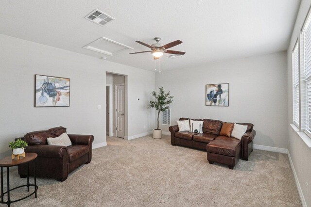 113 Berkeley Pl, Georgetown, TX 78628 - living area with attic access, light colored carpet, and a ceiling fan