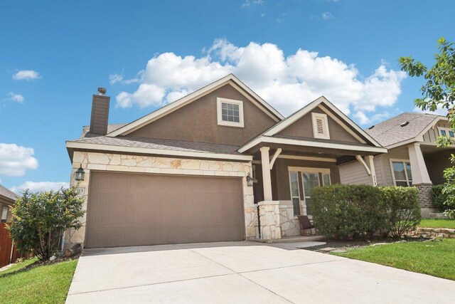 113 Berkeley Pl, Georgetown, TX 78628 - craftsman-style house featuring stone siding, driveway, an attached garage, a chimney, and stucco siding