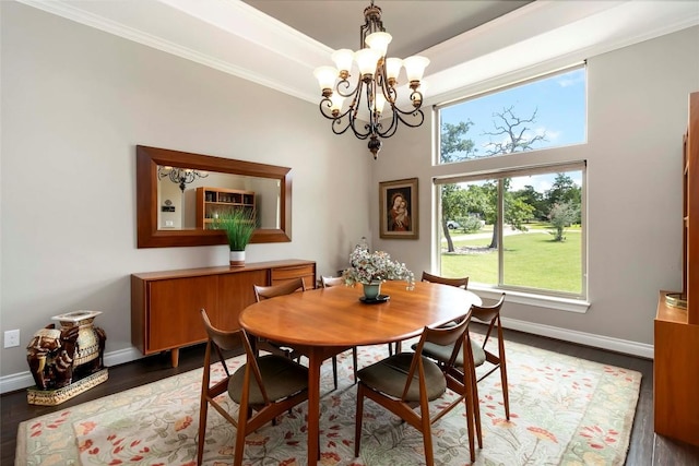106 Packsaddle Dr, Bastrop, TX 78602 - dining space featuring a chandelier, wood finished floors, and crown molding