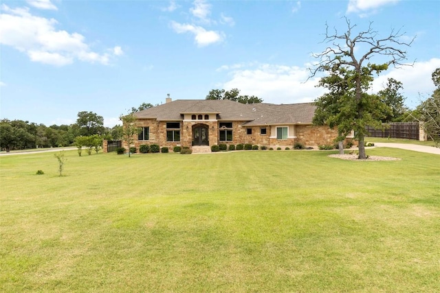 106 Packsaddle Dr, Bastrop, TX 78602 - prairie-style home featuring a front yard, a chimney, and driveway