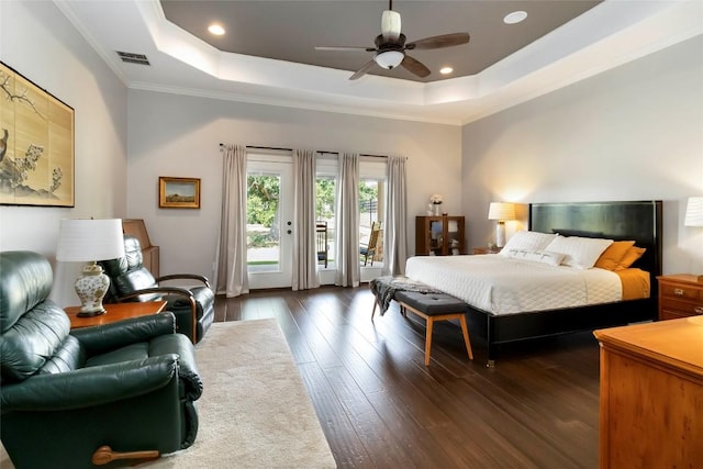 106 Packsaddle Dr, Bastrop, TX 78602 - bedroom with a tray ceiling, dark wood-type flooring, access to outside, crown molding, and recessed lighting