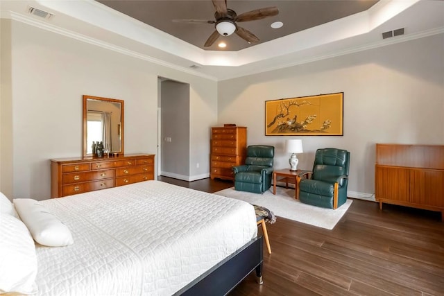 106 Packsaddle Dr, Bastrop, TX 78602 - bedroom featuring a raised ceiling, dark wood-style flooring, ornamental molding, recessed lighting, and a ceiling fan