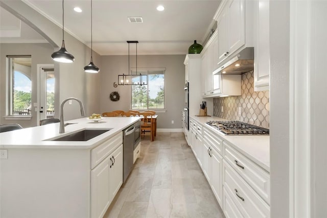106 Packsaddle Dr, Bastrop, TX 78602 - kitchen featuring under cabinet range hood, appliances with stainless steel finishes, backsplash, white cabinets, and recessed lighting