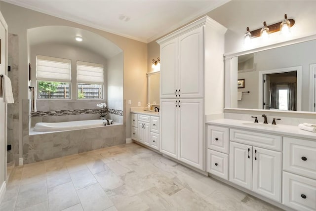 106 Packsaddle Dr, Bastrop, TX 78602 - full bath featuring two vanities, a garden tub, ornamental molding, and marble finish floors