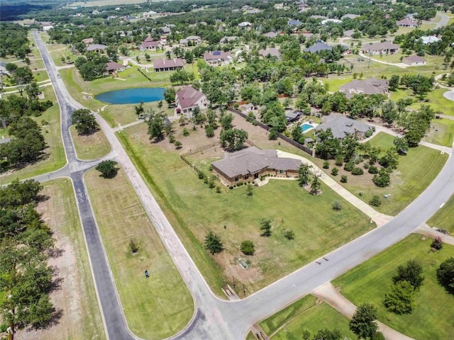 106 Packsaddle Dr, Bastrop, TX 78602 - aerial overview of property's location featuring a large body of water and nearby suburban area