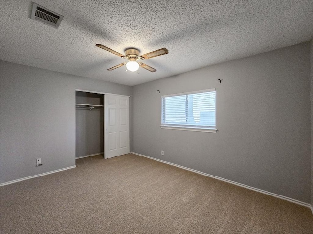 1318 Chalk Ln, Cedar Park, TX 78613 - unfurnished bedroom featuring carpet floors, a closet, ceiling fan, and a textured ceiling