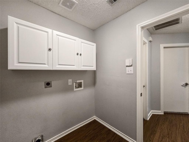 1318 Chalk Ln, Cedar Park, TX 78613 - laundry room featuring dark wood-style floors, cabinet space, washer hookup, electric dryer hookup, and a textured ceiling