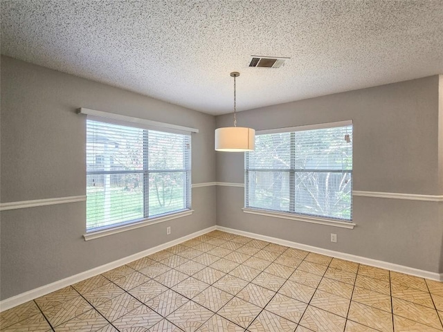1318 Chalk Ln, Cedar Park, TX 78613 - spare room featuring baseboards and a textured ceiling
