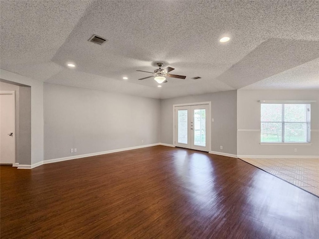1318 Chalk Ln, Cedar Park, TX 78613 - unfurnished room featuring a textured ceiling, dark wood-style floors, a ceiling fan, recessed lighting, and french doors