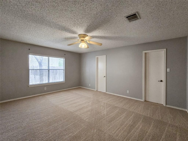 1318 Chalk Ln, Cedar Park, TX 78613 - carpeted empty room featuring ceiling fan and a textured ceiling