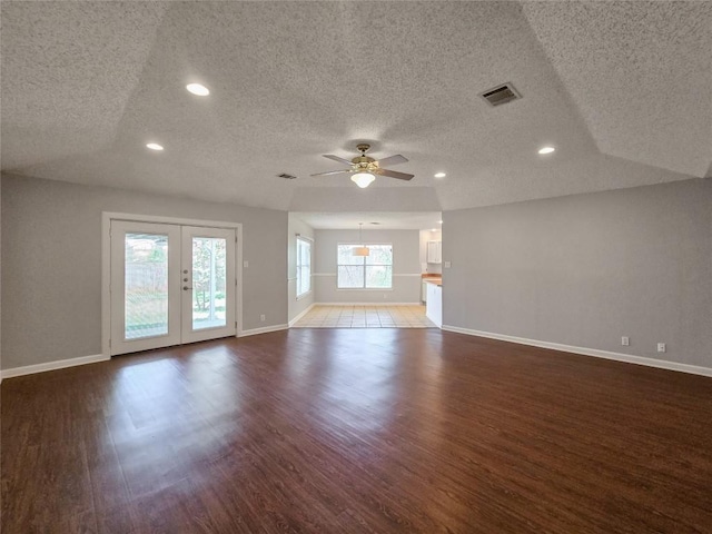 1318 Chalk Ln, Cedar Park, TX 78613 - unfurnished living room with a textured ceiling, wood finished floors, a ceiling fan, french doors, and recessed lighting