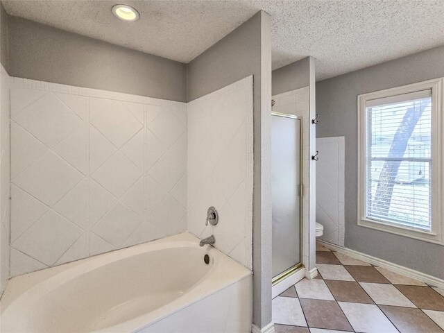1318 Chalk Ln, Cedar Park, TX 78613 - full bathroom featuring a shower stall, a bath, tile patterned floors, and a textured ceiling