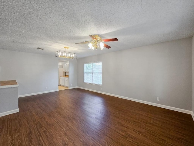1318 Chalk Ln, Cedar Park, TX 78613 - spare room with a ceiling fan, dark wood-style flooring, and a textured ceiling
