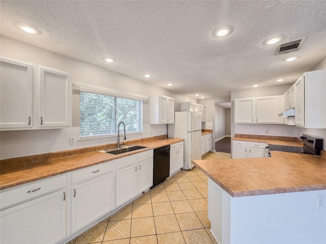 1318 Chalk Ln, Cedar Park, TX 78613 - kitchen featuring stainless steel range with electric cooktop, black dishwasher, freestanding refrigerator, under cabinet range hood, and a textured ceiling