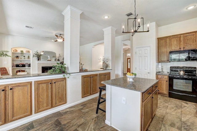 4304 Lost Oasis Holw, Austin, TX 78739 - kitchen with black appliances, a ceiling fan, a fireplace, and brown cabinets