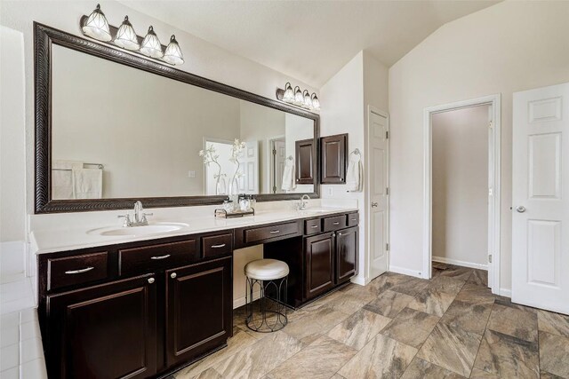 4304 Lost Oasis Holw, Austin, TX 78739 - full bath with lofted ceiling, double vanity, and stone finish floors