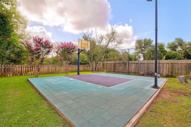 4304 Lost Oasis Holw, Austin, TX 78739 - view of basketball court with basketball hoop and a fenced backyard