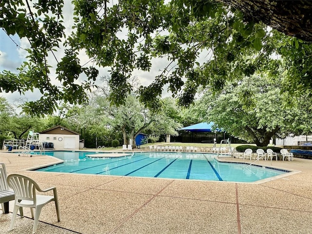 4304 Lost Oasis Holw, Austin, TX 78739 - community pool featuring a patio area and view of wooded area