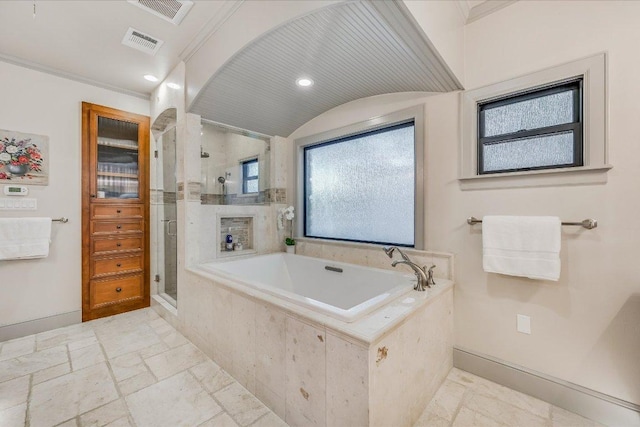 14305 Geronimo St, Leander, TX 78641 - bathroom with a shower stall, a garden tub, and stone tile flooring