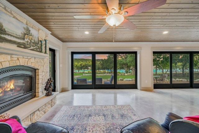 14305 Geronimo St, Leander, TX 78641 - living area featuring wood ceiling, plenty of natural light, a stone fireplace, recessed lighting, and ceiling fan