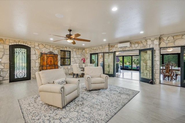 14305 Geronimo St, Leander, TX 78641 - living area featuring a wall mounted AC, ceiling fan, and crown molding