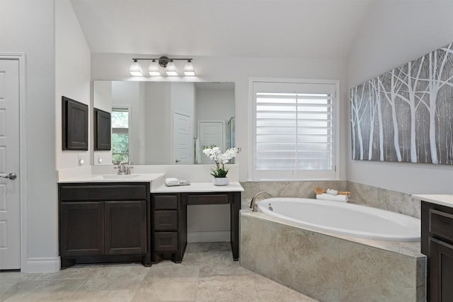 624 Judge Fisk Dr, Leander, TX 78641 - bathroom featuring vanity, a bath, and vaulted ceiling