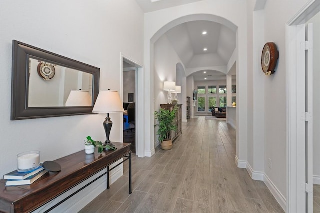 624 Judge Fisk Dr, Leander, TX 78641 - corridor featuring arched walkways, light wood-style floors, recessed lighting, and vaulted ceiling