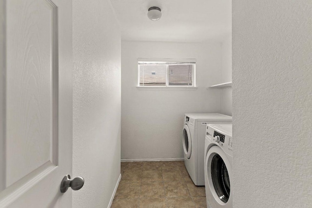 324 Kingfisher Ln, Leander, TX 78641 - laundry area with washing machine and clothes dryer and baseboards
