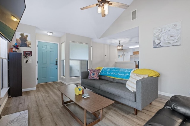 1821 Golden Pheasant Dr, Austin, TX 78758 - living room with light wood finished floors, a ceiling fan, and high vaulted ceiling