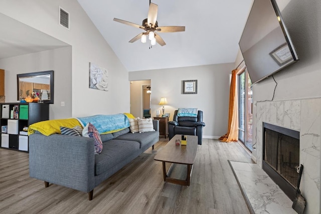1821 Golden Pheasant Dr, Austin, TX 78758 - living area with wood finished floors, ceiling fan, a high end fireplace, and high vaulted ceiling